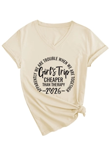 Detail of V-neck apricot t-shirt with black slogan print and front knot design