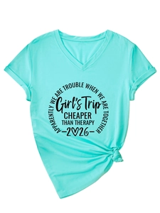 Detail of V-neck short sleeve mint green t-shirt with rolled cuffs and graphic print