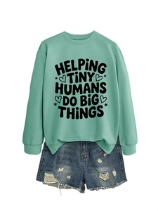 Mint green sweatshirt with helping tiny humans print and distressed denim shorts