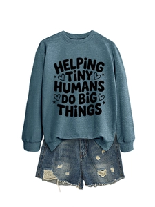 Detail of blue-grey sweatshirt with Helping Tiny Humans print and denim shorts