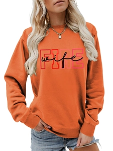 Detail of the creative FIRE wife print on a casual orange crewneck sweatshirt
