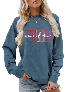 Detail of blue crewneck sweatshirt featuring red FIRE and white wife print design