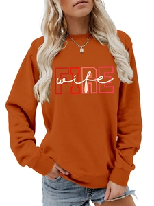 Detail of burnt orange crewneck sweatshirt with FIRE wife lettering and ribbed cuffs