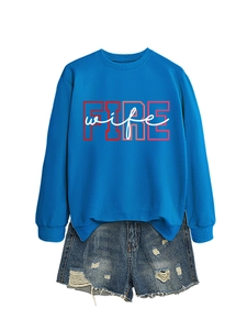 Detail of royal blue sweatshirt with red FIRE wife print and distressed denim shorts