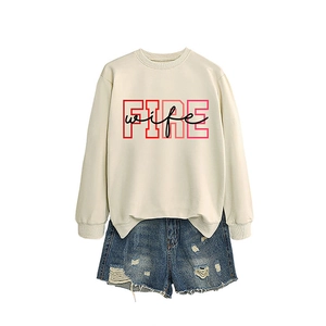 Off-white crewneck sweatshirt with Fire Wife print and distressed denim shorts