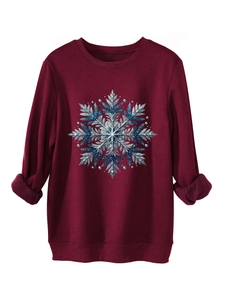 Detail van bordeaux sweatshirt met warme fleecevoering en blauwe glitter sneeuwvlok print