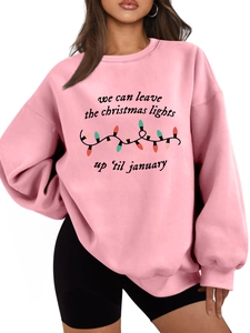 Sudadera rosa oversize con gráfico de luces navideñas y detalle de tipografía festiva