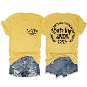 Detail of Girl's Trip 2026 cotton t-shirt with Cheaper Than Therapy print and denim shorts