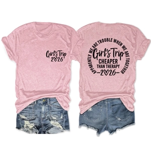 Detail view of pink Girls Trip 2026 t-shirt and distressed denim shorts casual outfit