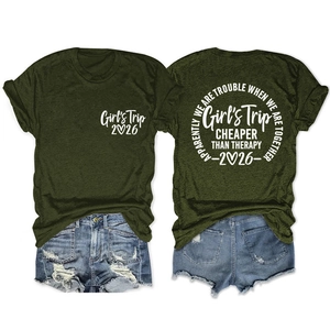 Detail view of army green Girl's Trip 2026 t-shirt and distressed denim shorts