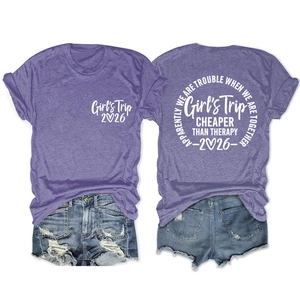 Front and back view of purple Girl's Trip 2026 T-shirt with blue denim shorts