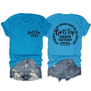 Front and back view of peacock blue Girl's Trip 2026 crewneck t-shirts with denim shorts