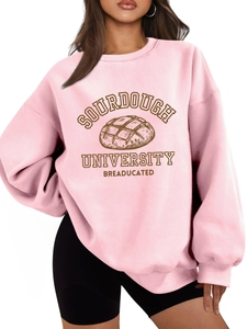 Close-up of Sourdough University graphic print on pink oversized cotton sweatshirt