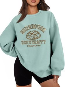 Detail of Sourdough University graphic and soft cotton fabric on light blue sweatshirt