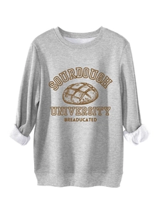 Detail of grey sweatshirt showing warm fleece lining and Sourdough University print