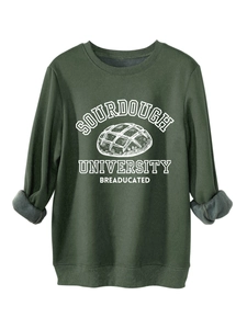 Detailed view of dark green fleece sweatshirt with Sourdough University print and soft lining