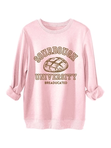 Detailed close-up of Sourdough University print on pink warm thick sweatshirt