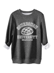 Close-up of dark grey sourdough university sweatshirt showing warm white fleece lining
