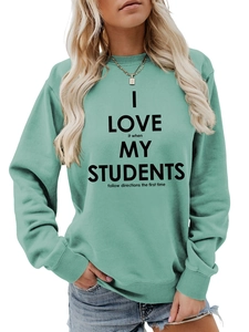 Détail du sweat-shirt enseignant vert menthe avec le slogan I Love It When My Students