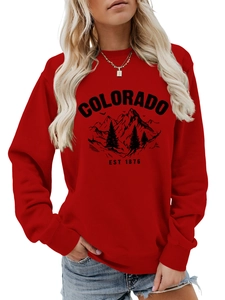 Detail of red crewneck sweatshirt featuring Colorado graphic and mountain print