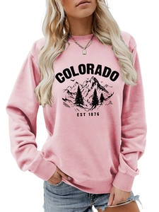 Close-up of ribbed neckline and retro Colorado mountain print on pink sweatshirt