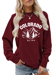 Detail of Colorado Est 1876 print and ribbed texture on burgundy casual sweatshirt