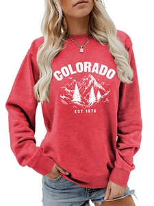 Detail view of red Colorado EST 1876 sweatshirt featuring mountain print and ribbed cuffs