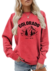 Close-up of red Colorado mountain print sweatshirt showing ribbed cuffs and soft fabric