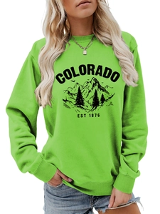 Close-up of Colorado Est 1876 vintage mountain print on light green sweatshirt