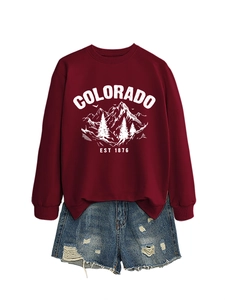 Detail of Colorado EST 1876 printed burgundy sweatshirt with mountain graphic design