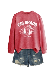 Detail of burgundy Colorado sweatshirt paired with distressed denim shorts