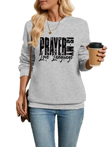 Close-up of gray sweatshirt with PRAYER IS MY Love Language print and ribbed cuffs