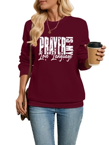 Detail of burgundy ribbed cuffs and hem on women's prayer-themed fleece sweatshirt