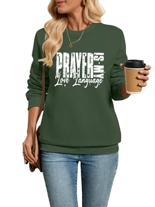 Detail of dark green sweatshirt featuring white distressed Prayer Is My Love Language text