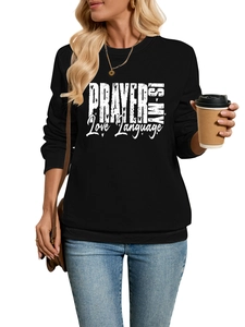 Detail of black long-sleeve sweatshirt featuring Prayer Is My Love Language slogan print