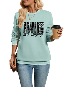 Close-up of the slogan print on light blue plush fleece sweatshirt for women