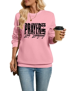 Close-up of pink sweatshirt featuring PRAYER IS MY Love Language print and ribbed cuffs