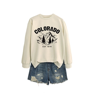 Colorado Est 1876 cream sweatshirt with mountain print and blue distressed denim shorts
