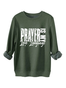 Detail of dark green sweatshirt with PRAYER IS MY LOVE text and warm fleece lining
