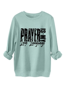Detail of light mint green fleece sweatshirt with Prayer Is My Love Language print