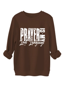 Detail of ribbed cuffs and white letter print on a thick dark brown sweatshirt
