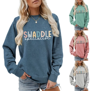 Detail view of cotton sweatshirt in blue, green, pink and grey with artist lettering