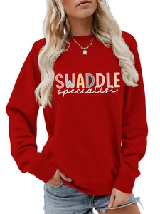 Close-up of artistic letter print on red crewneck long sleeve sweatshirt for women