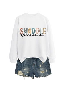 Close-up of white letter print sweatshirt and distressed denim shorts set