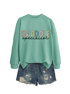 Mint green crewneck sweatshirt paired with blue distressed denim shorts set