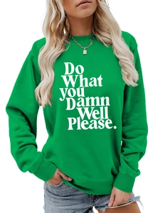 Detail of bright green crewneck sweatshirt with 'Do What You Damn Well Please' white text