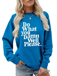 Detail of blue crewneck sweatshirt featuring bold white Do What You Damn Well Please slogan