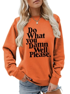Detail of orange crewneck sweatshirt with 'Do What YOU Damn Well Please' text