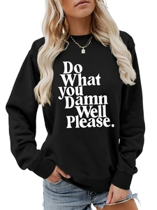 Close-up of black crewneck sweatshirt with 'Do What You Damn Well Please' white lettering