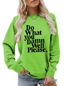 Close-up of bright green sweatshirt featuring bold black slogan and ribbed collar